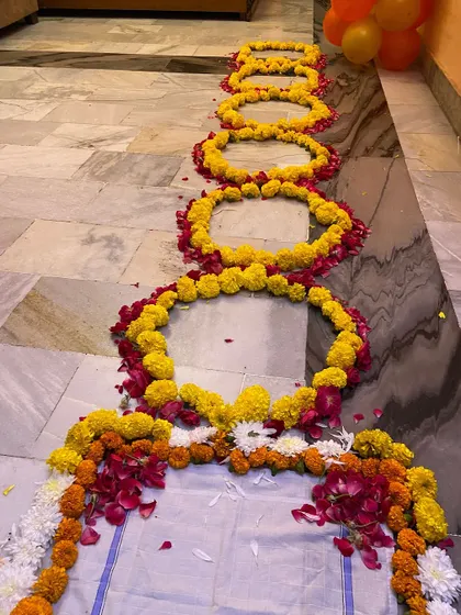 This shows the length of the floral pathway I can create, leading the bride into her new home. Each section is carefully arranged with marigolds and rose petals.