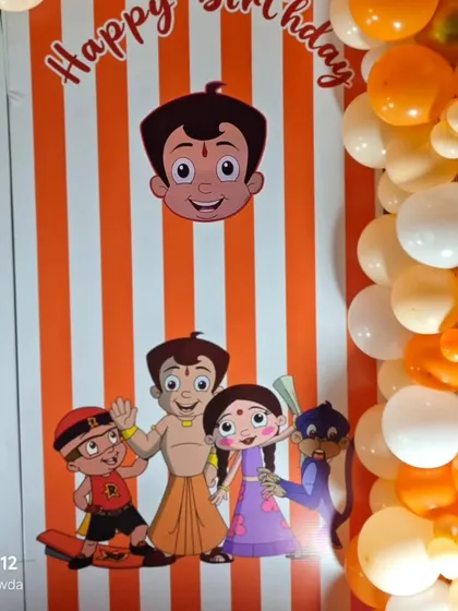 Another detail from the Chhota Bheem setup, showing the characters against an orange and white striped background.
