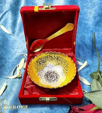 A close-up view of our single aluminium bowl with intricate silver and gold detailing, complete with a spoon and red velvet box. We manufacture these in-house, ensuring quality at a wholesale price.