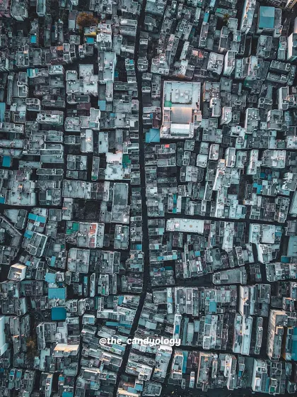 A bird's eye view of the dense urban fabric of Dahod, Gujarat. The top-down perspective reveals the intricate patterns and geometry of the city.