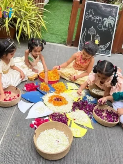 An overhead view of children creating a Pookalam, their hands working together to form a beautiful floral pattern. This activity is a feast for the senses and a lesson in collaboration.