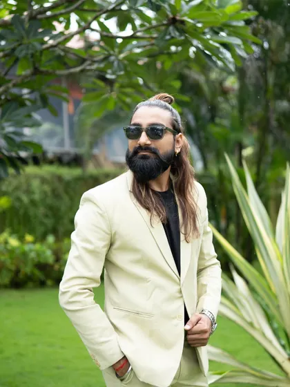 Another look at my personal style. The man bun, beard, and sunglasses are all part of the 'Dancing Bartender' persona that guests love.