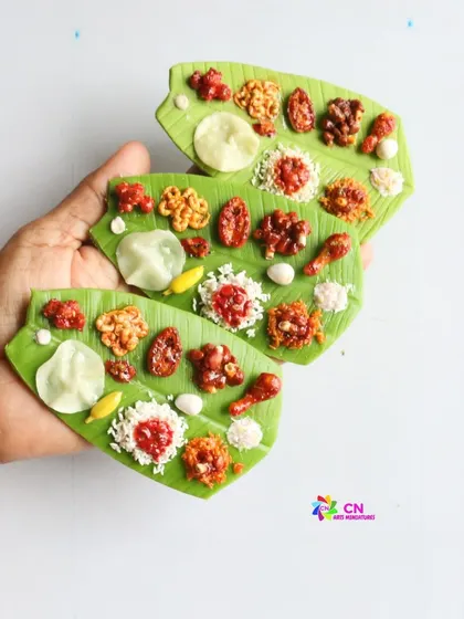 A set of three non-veg leaf meal magnets, showcasing the delicious-looking chicken and fish dishes.