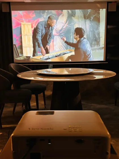 The ViewSonic short throw projector in action, creating a large, bright image from just a short distance away. This type of projector is ideal for smaller rooms or spaces where a ceiling mount isn't practical.