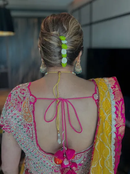 Another angle of the French twist, a chic and elegant choice for any wedding function.