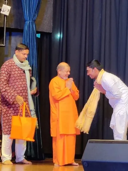 A moment of receiving blessings from Tejomayanand Swamiji during the Naada Bindu festival at Chinmaya Vibhooti, Pune.