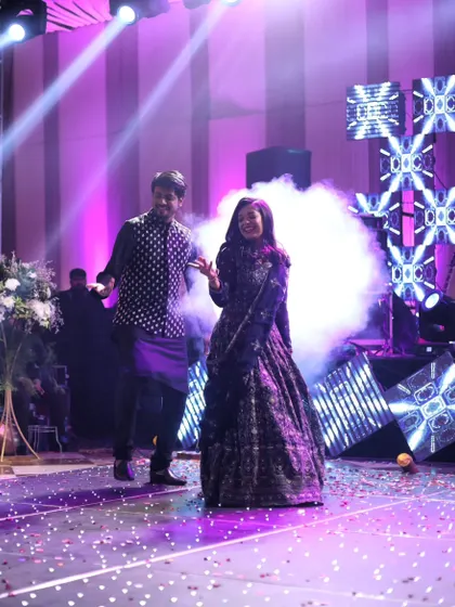 Surrounded by smoke and lights, this couple owned the stage. We help manage all the technical aspects like lighting and special effects to elevate your performance.