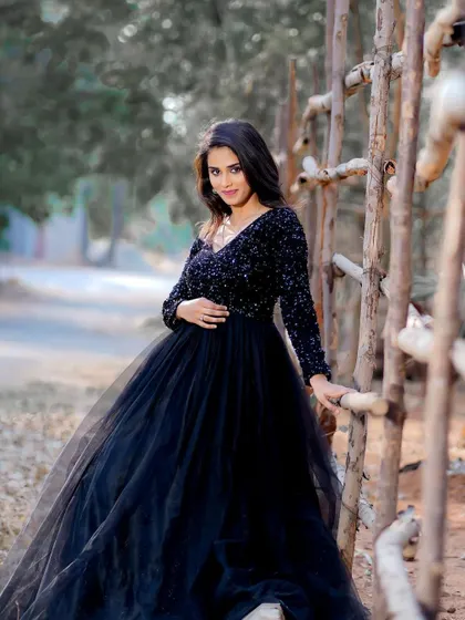 A full-length outdoor shot featuring a black evening gown. I created a smoky eye with a pop of pink and a nude lip to create a dramatic yet elegant look for this fashion shoot.