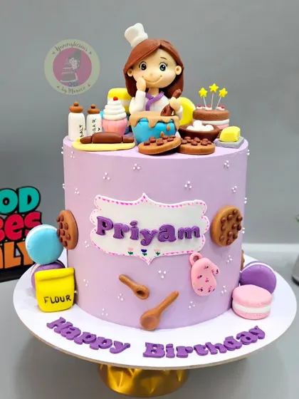 A similar baker-themed cake for Priyam, this time in a lovely lavender shade with even more miniature baking elements.