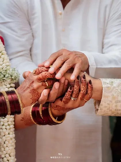 The joining of hands by the couple and their parents, a beautiful symbol of two families coming together. I ensure these family-centric moments are given the importance they deserve.