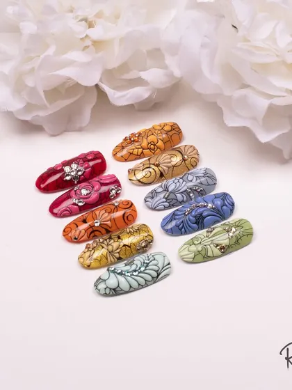 Another beautiful shot of my embossed and crystal-accented designs. I love the rich colors and intricate patterns.