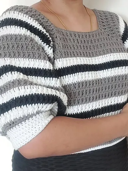 A side view of the Diana Crop Top, highlighting the voluminous puff sleeves.