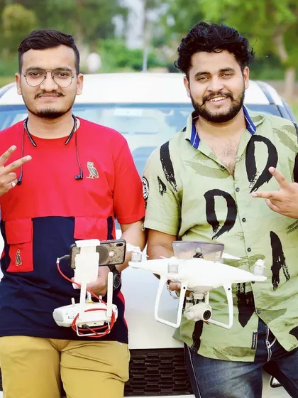 My team and I with our drone fleet, ready for an outdoor shoot. Having multiple drones like the DJI Air 2S ensures we have the right equipment for any situation.
