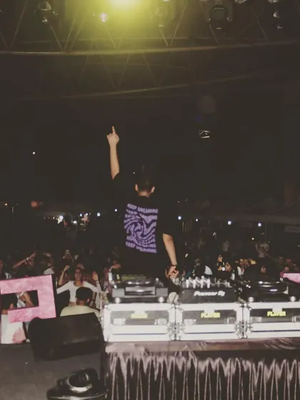 One hand up for the crowd. Engaging with the audience is a key part of my performance style.