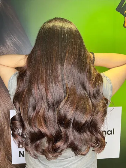 Another view of the wine red balayage, showing off the rich tones and healthy shine.