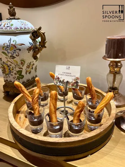 Indulge your guests with our decadent dessert offerings. These crispy churros served in individual glasses with a rich, dark chocolate dip are a perfect sweet ending to any meal and a guaranteed crowd-pleaser.