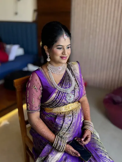 Meghana looking radiant for her Seemantham. We chose a glamorous look with diamond jewellery and a beautiful purple saree, with makeup that highlighted her happy glow.