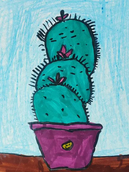 A close-up of the cactus drawing, showing the texture and color choices made by the young artist.