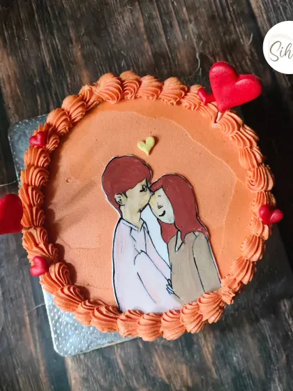 Edible sketching is such a fun way to bring out the creative side. This bento cake features a sweet, hand-drawn illustration of a couple.