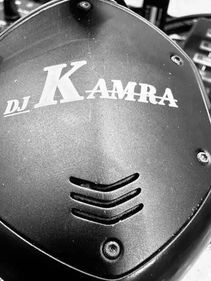 A close-up of my custom DJ Kamra headphones. The brand is a promise of quality and high-energy entertainment.