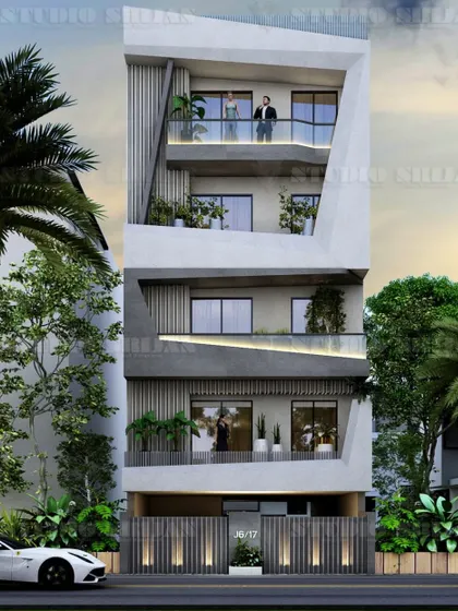 A highly geometric and angular facade designed for a 160 sq. yard plot in Rajouri Garden. This design uses deconstructed forms and sharp lines to create a sculptural and ultra-modern exterior.