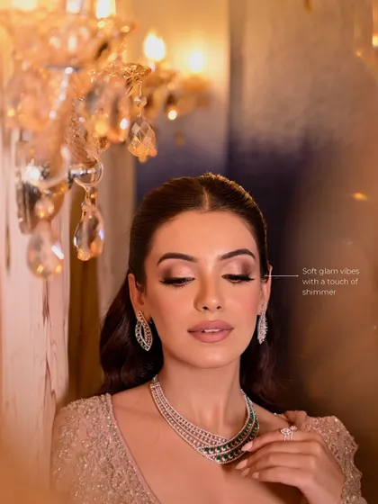 A beautiful example of a "Rosy Glow" look. The focus is on soft, shimmery pink eyeshadow, luminous skin, and nude lips with a hint of pink.
