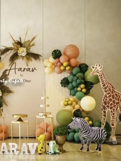A stylish and modern take on the safari theme for Aaran's 'Wild One' party. We used a neutral color palette with pampas grass, a circular backdrop, and life-sized animal props for a chic look.