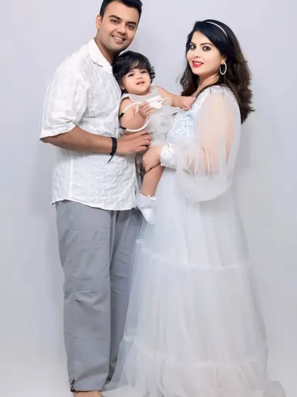 Capturing a precious family moment. This white sequin and tulle gown is perfect for maternity shoots, and we even have matching options for little ones.