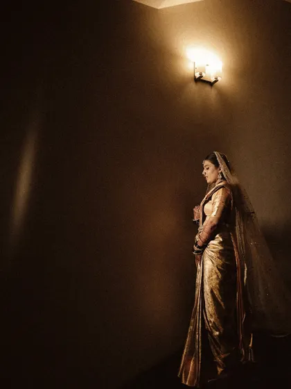 A dramatic and moody bridal portrait. I used minimal lighting to create a sense of timelessness and artistry, with the bride looking like a figure from a classic painting.