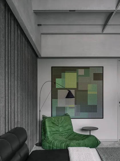 Another view of the son's bedroom, showing the headboard wall made of unequal vertical slats of rugged granite stone.