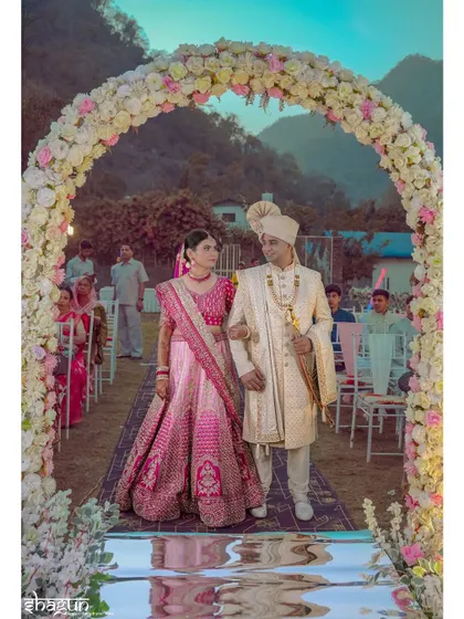 A closer look at the couple walking down the mirrored aisle, their reflection symbolizing the start of their shared journey.