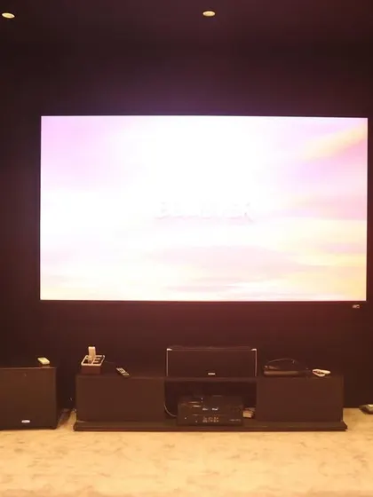 A duplicate of 310, this shot again showcases the powerful floor-standing speakers and the large, high-quality screen.