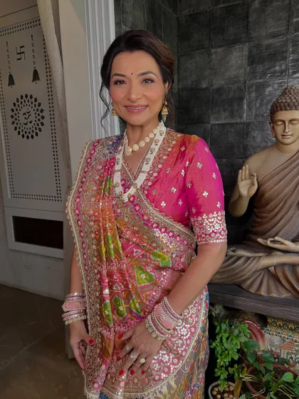 A full-length shot of her in a traditional Gujarati outfit, looking absolutely regal.