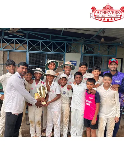 Another shot of the champions, holding the trophy high. This victory was a true team effort.