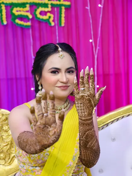 A close-up of the bride's hands and face.