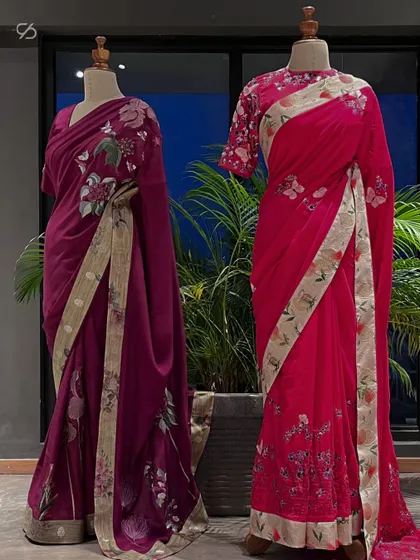 I delve into designs that exude self-assured elegance. These two floral embroidered sarees in magenta and wine tones showcase my love for vibrant colors and intricate details.