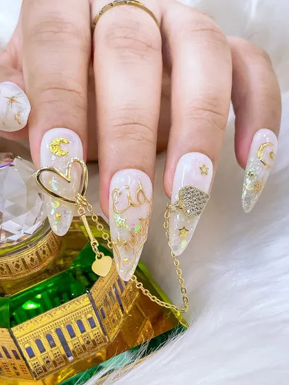 The full set of Eid nails, showcasing a beautiful combination of glitter, gold chrome, and 3D embellishments for a luxurious festive look.