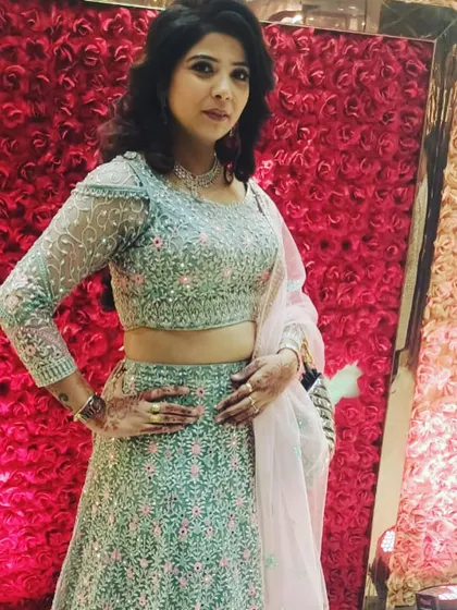 Another shot of the mint green and pink floral rental lehenga. The full-sleeved blouse makes it a great choice for cooler weather.