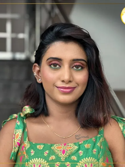A happy and bright portrait. The dual-toned eyeshadow adds a fun, creative element, while the rest of the makeup is kept clean and glowing.