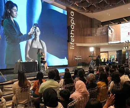 A wide shot of my masterclass in Bengaluru, with my live demo projected on a huge screen. I love connecting with large audiences and sharing my knowledge.