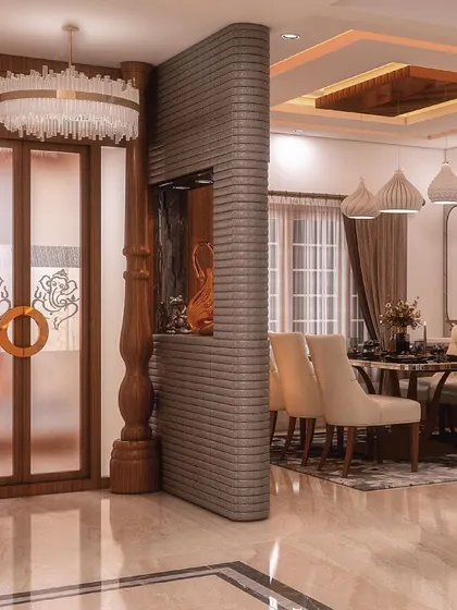 This view showcases the traditional pooja unit with frosted glass doors and wooden carvings, seamlessly integrated with the modern dining area. The 3D brick-paneled partition adds texture and separates the spaces beautifully.
