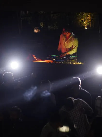 A wide shot of me at the decks, with the crowd in the foreground.