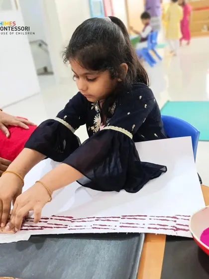 A child engages in a hands-on art activity, demonstrating the creative exploration that our individualized learning philosophy encourages.