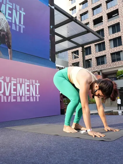 A shot of a forward fold during the Lululemon event. Even in a large, outdoor setting, it's important to cue proper form and technique, which is a key focus of my instructor certification.