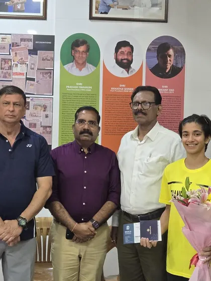 A group photo during the felicitation of Malvika Bansod, with me and other officials present to honor her success.