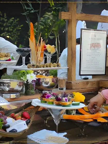 Guests enjoying our appetizer station, which includes a wide range of options from cheese and fruit to savory bites, all styled by our expert food stylist.