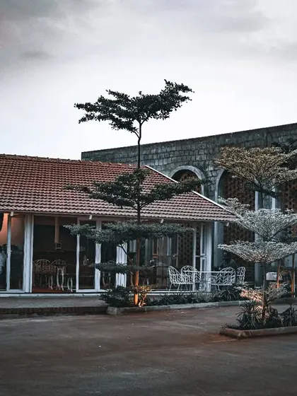 A cozy coffee shop with a moody, overcast sky in the background. This shot captures a perfect place to relax on a gloomy day.