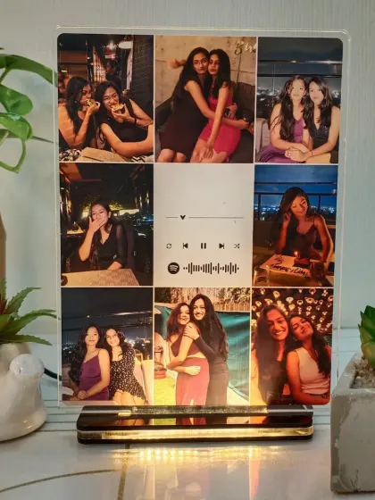 A multi-photo collage printed on an acrylic plaque with a Spotify song code. The wooden base is illuminated, making it a beautiful tabletop display.