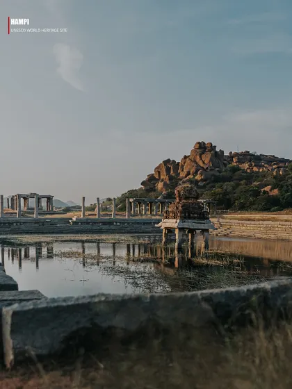 A series of images presented as pages from a travel magazine, each with a text overlay explaining Hampi's history. These photos capture various ruins, including temple tanks, stone pillars, and mandapas, telling the story of the lost empire.