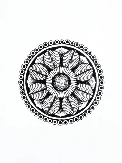 This circular mandala features leaf-like patterns and a stippled center. It's a calming, nature-inspired design created with fine-liner pens.